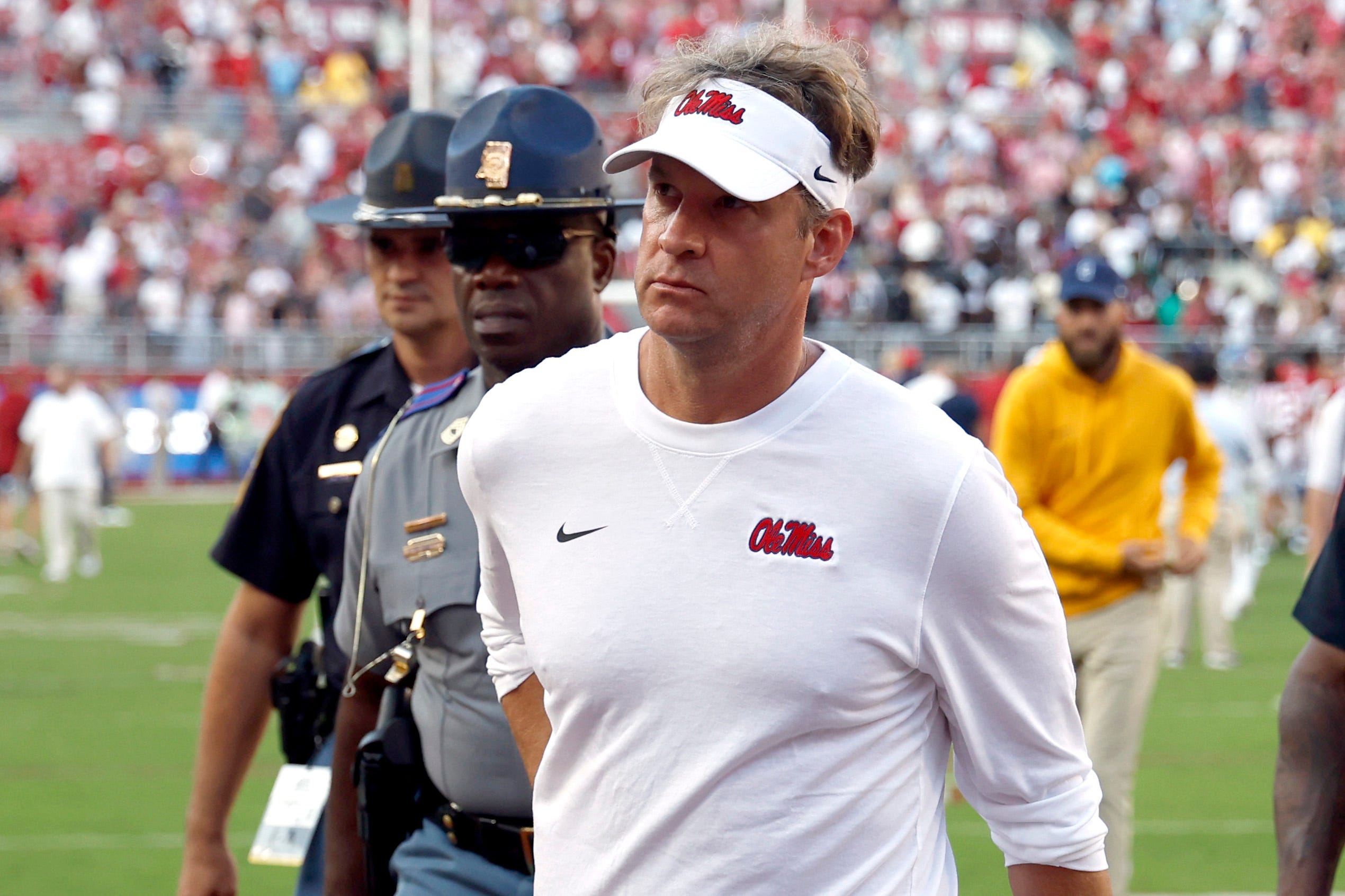Mississippi coach Lane Kiffin walks off the field after his team's 24-10 loss to Alabama at Bryant-Denny Stadium.