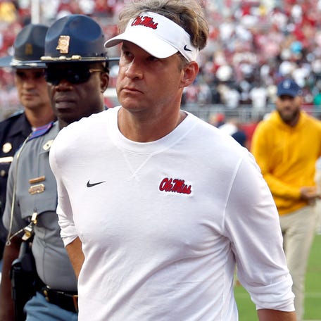Mississippi coach Lane Kiffin walks off the field after his team's 24-10 loss to Alabama at Bryant-Denny Stadium.