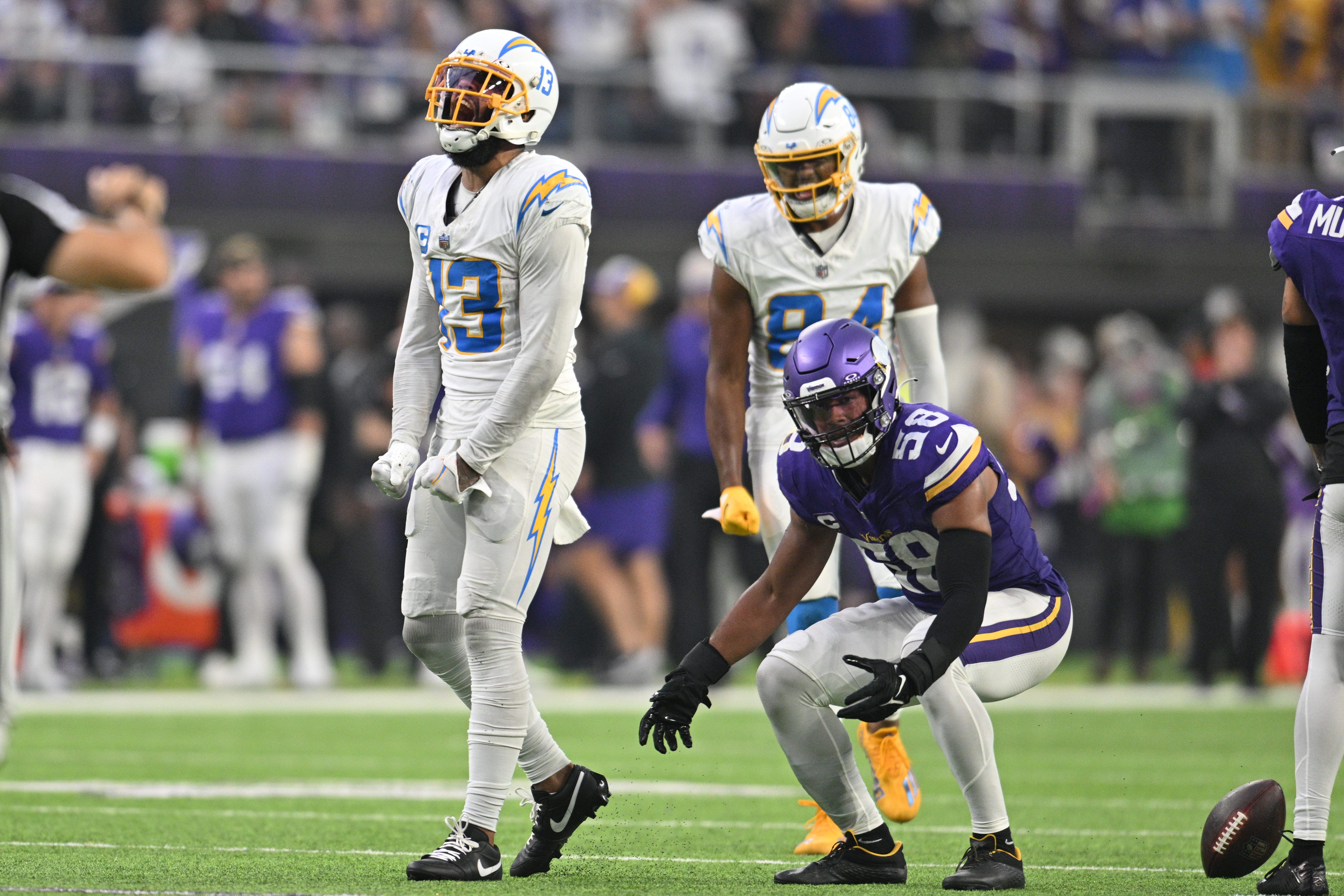 Los Angeles Chargers wide receiver Keenan Allen (13) reacts as Minnesota Vikings linebacker Jordan Hicks (58) looks on during the fourth quarter at U.S. Bank Stadium.