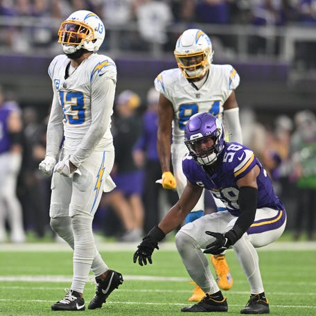 Los Angeles Chargers wide receiver Keenan Allen (13) reacts as Minnesota Vikings linebacker Jordan Hicks (58) looks on during the fourth quarter at U.S. Bank Stadium.