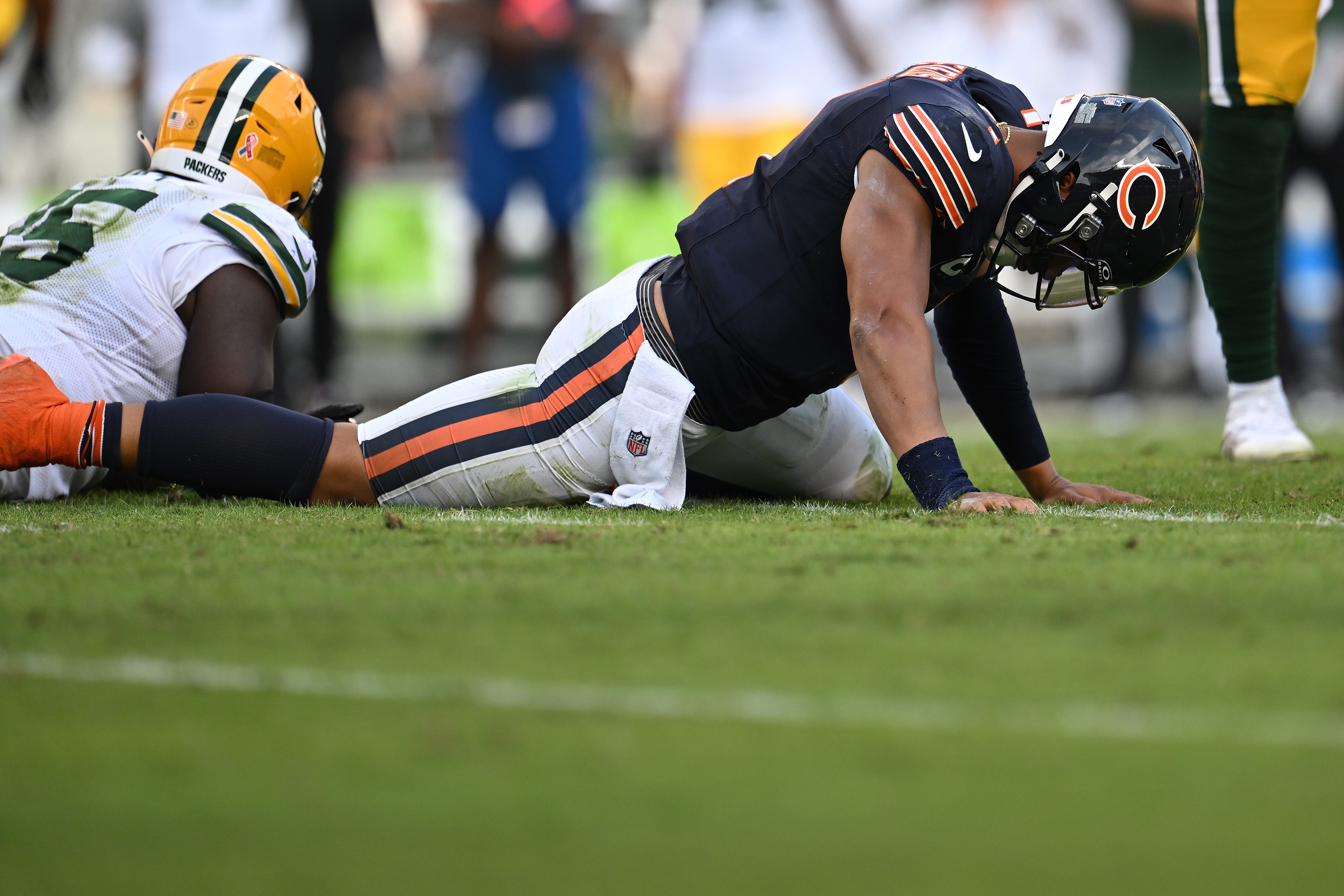 Justin Fields #1 of the Chicago Bears reacts after fumbling the ball against the Green Bay Packers during the second half at Soldier Field on September 10, 2023 in Chicago, Illinois.