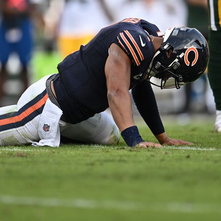 Justin Fields #1 of the Chicago Bears reacts after fumbling the ball against the Green Bay Packers during the second half at Soldier Field on September 10, 2023 in Chicago, Illinois.