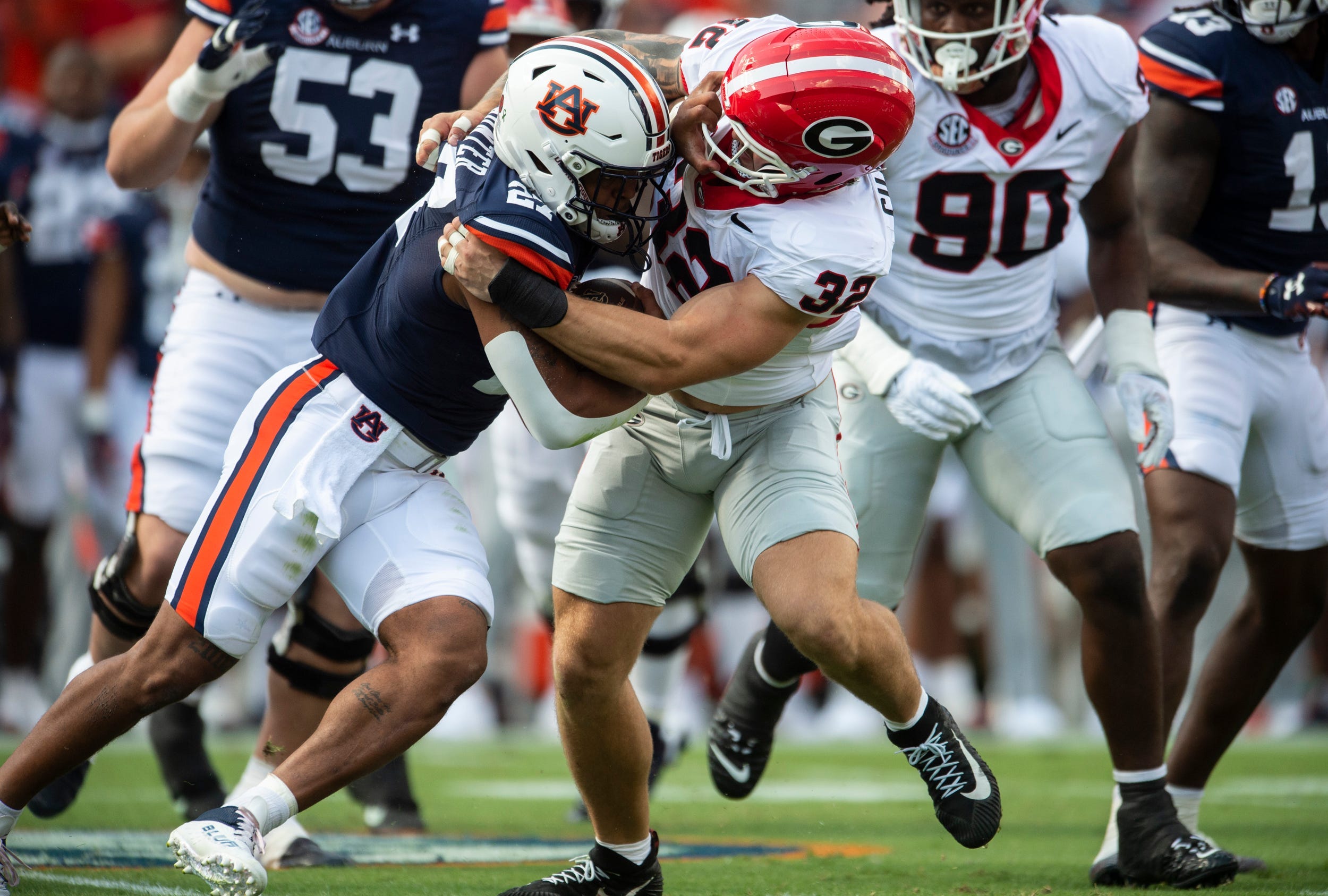 Auburn running back Jarquez Hunter (27) is stopped in the backfield by Georgia outside linebacker Chaz Chambliss (32) at Jordan-Hare Stadium in Auburn, Ala., on Saturday, Sept. 30, 2021.