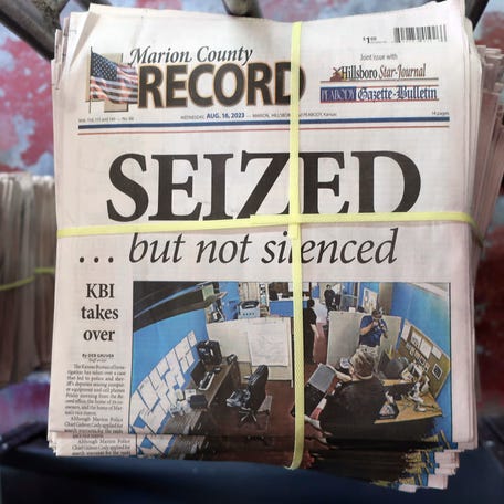 FILE - A stack of the Marion County Record sits in the back of the newspaper's building, awaiting unbundling, sorting and distribution, Aug. 16, 2023, in Marion, Kan.