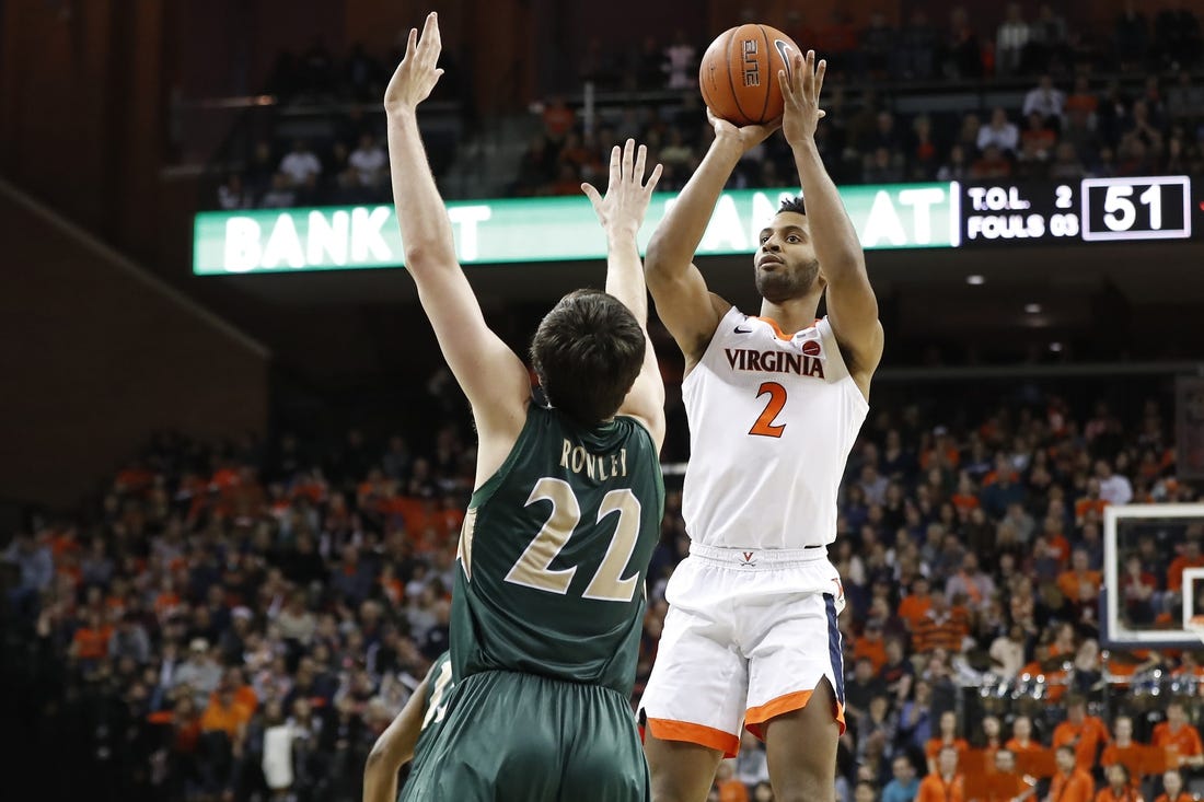 Virginia Cavaliers guard Braxton Key (2) shoots the ball as William & Mary Tribe forward Paul Rowley (22) defends in the second half at John Paul Jones Arena. The Cavaliers won 72-40.