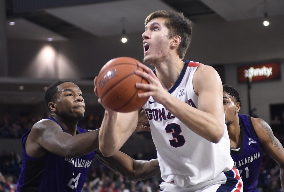 Gonzaga Bulldogs forward Filip Petrusev (3) is fouled by North Alabama Lions forward Emanuel Littles (21) in the second half at McCarthey Athletic Center. The Bulldogs won 96-51.