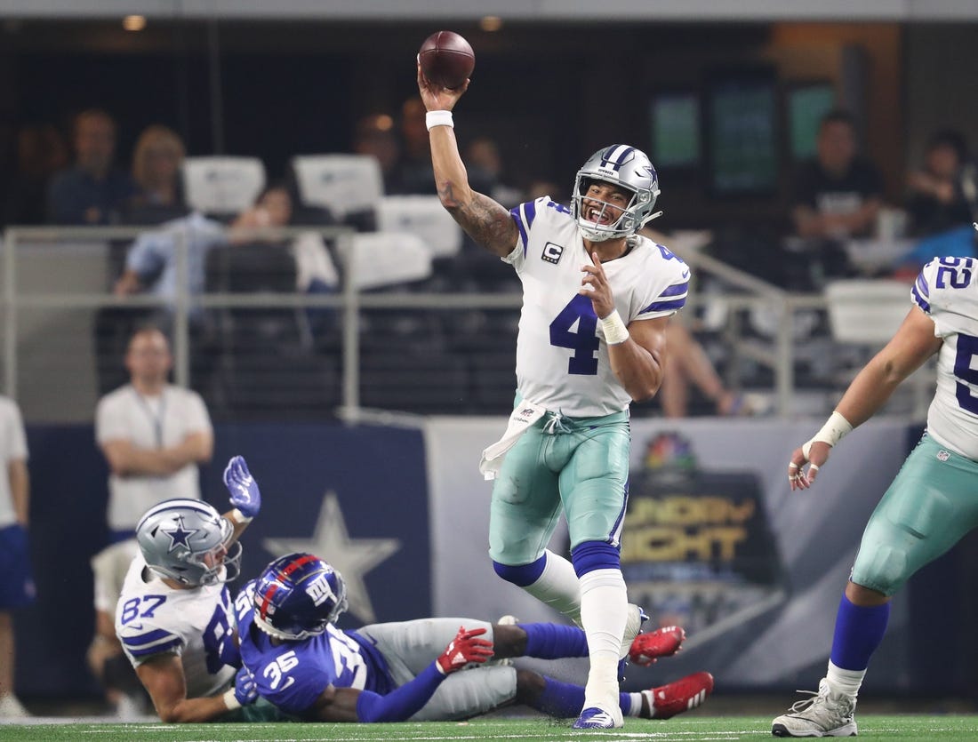 Cowboys quarterback Dak Prescott (4) throws in the pocket in the fourth quarter against the New York Giants on Sunday night at AT&T Stadium.