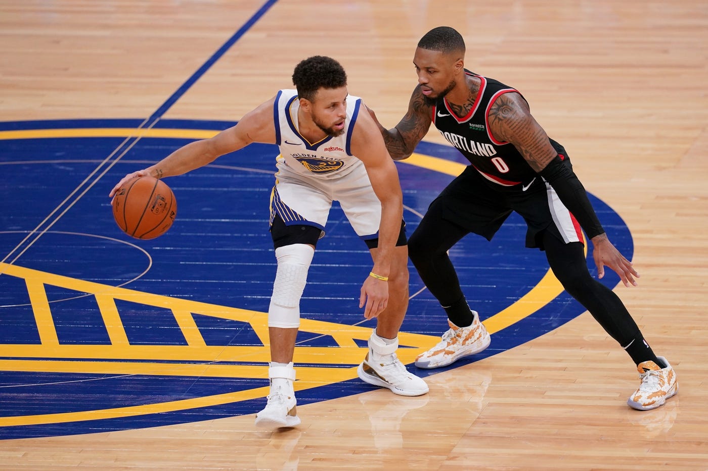 Jan 1, 2021; San Francisco, California, USA; Golden State Warriors guard Stephen Curry (30) dribbles the ball against Portland Trail Blazers guard Damian Lillard (0) in the third quarter at the Chase Center.
