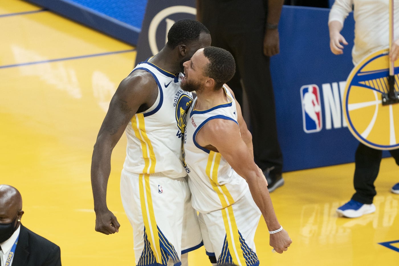 May 16, 2021; San Francisco, California, USA; Golden State Warriors guard Stephen Curry (30) celebrates with forward Draymond Green (23) against the Memphis Grizzlies during the fourth quarter at Chase Center. 