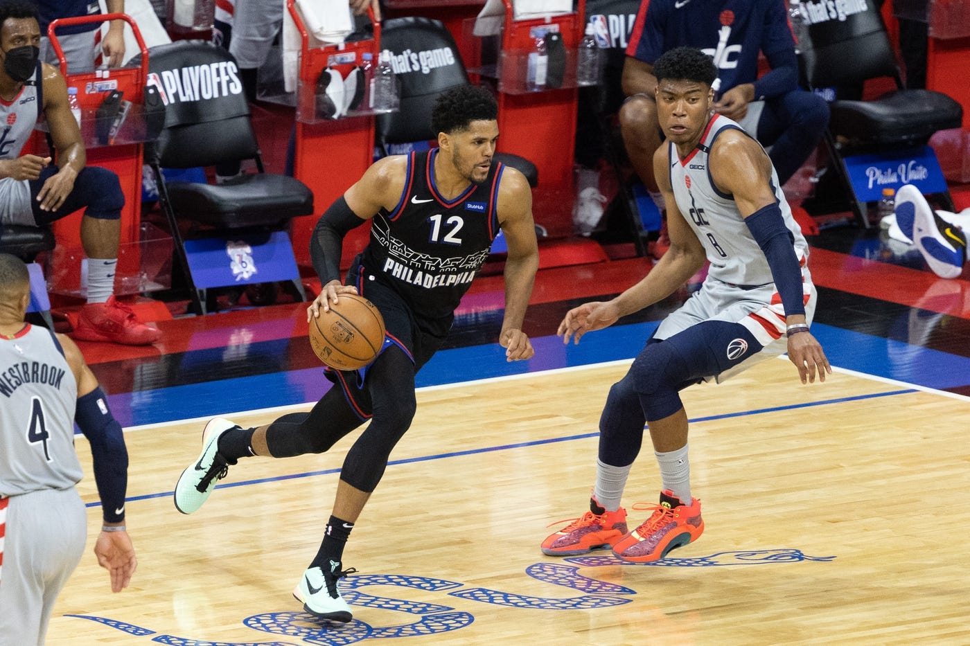 May 23, 2021; Philadelphia, Pennsylvania, USA; Philadelphia 76ers forward Tobias Harris (12) dribbles against Washington Wizards forward Rui Hachimura (8) during the fourth quarter of game one in the first round of the 2021 NBA Playoffs at Wells Fargo Center.