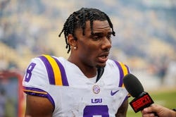 Nov 25, 2023; Baton Rouge, Louisiana, USA;  LSU Tigers wide receiver Malik Nabers (8) talks to the media after the game against the Texas A&M Aggies at Tiger Stadium. Mandatory Credit: Stephen Lew-USA TODAY Sports