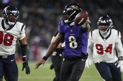 Jan 20, 2024; Baltimore, MD, USA; Ravens quarterback Lamar Jackson (8) runs in for a touchdown in Baltimore's Divisional Round win over the Houston Texans, 34-10. Mandatory Credit: Tommy Gilligan-USA TODAY Sports