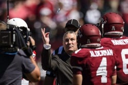 Sep 7, 2013; Philadelphia, PA, USA; American Athletic Conference Commissioner Mike Aresco flips a coin prior to the start of the game between the Temple Owls and the Houston Cougars. Mandatory Credit: Howard Smith-USA TODAY Sports