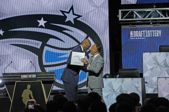 NBA: Draft Lottery - May 17, 2022; Chicago, IL, USA; Orlando Magic head coach Jamahl Mosley is congratulated by NBA deputy commissioner Mark Tatum after Orlando Magic won the first pick during the 2022 NBA Draft Lottery at McCormick Place. Mandatory Credit: David Banks-USA TODAY Sports