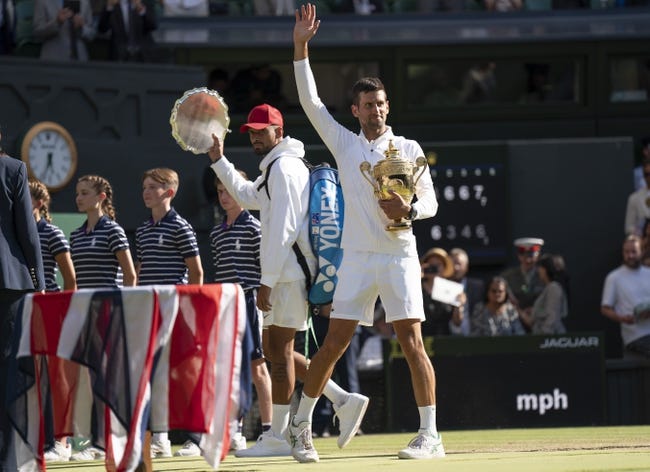 Tennis: Wimbledon - Jul 10, 2022; London, United Kingdom; Novak Djokovic (SRB) and Nick Kyrgios (AUS) leave the court the men   s final on day 14 at All England Lawn Tennis and Croquet Club. Mandatory Credit: Susan Mullane-USA TODAY Sports