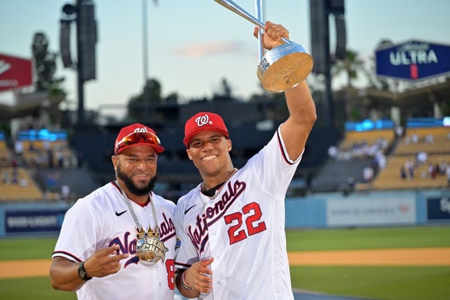 MLB: Home Run Derby - Jul 18, 2022; Los Angeles, CA, USA; Washington Nationals right fielder Juan Soto (22) celebrates with the trophy and his coach Jorge Meija after winning the 2022 Home Run Derby at Dodgers Stadium. Mandatory Credit: Jayne Kamin-Oncea-USA TODAY Sports
