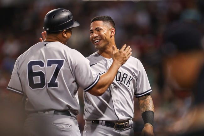 MLB: New York Yankees at Boston Red Sox - Sep 13, 2022; Boston, Massachusetts, USA; New York Yankees second baseman Gleyber Torres (25) celebrates after hitting a three run RBI during the tenth inning against the Boston Red Sox at Fenway Park. Mandatory Credit: Paul Rutherford-USA TODAY Sports