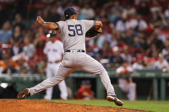 MLB: New York Yankees at Boston Red Sox - Sep 13, 2022; Boston, Massachusetts, USA; New York Yankees relief pitcher Wandy Peralta (58) delivers a pitch during the tenth inning against the Boston Red Sox at Fenway Park. Mandatory Credit: Paul Rutherford-USA TODAY Sports