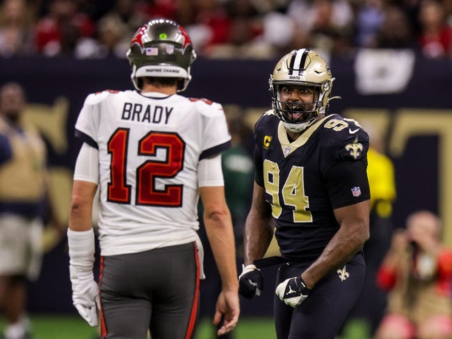 NFL: Tampa Bay Buccaneers at New Orleans Saints - Sep 18, 2022; New Orleans, Louisiana, USA;  New Orleans Saints defensive end Cameron Jordan (94) stares at Tampa Bay Buccaneers quarterback Tom Brady (12) and reacts to a play during the second half at Caesars Superdome. Mandatory Credit: Stephen Lew-USA TODAY Sports