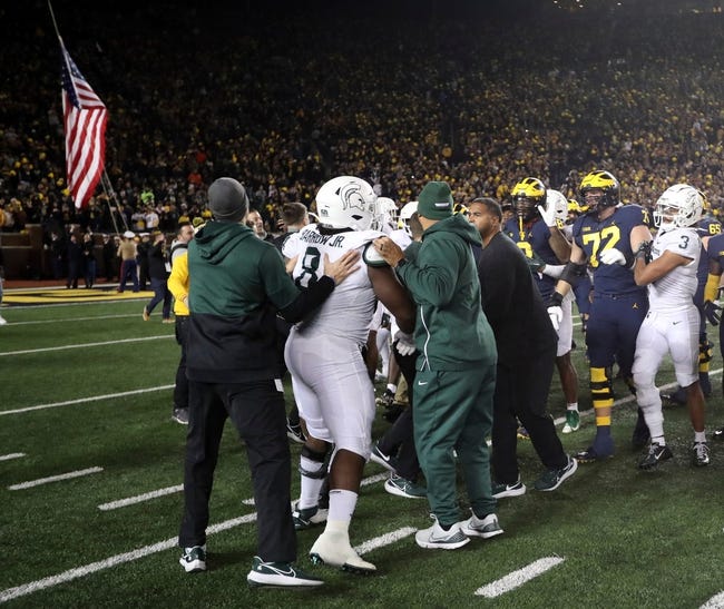 Syndication: Detroit Free Press - After the Michigan Wolverines beat the Michigan State Spartans, 29-7, to reclaim the Paul Bunyan Trophy, players from both teams had a shoving match on the Michigan Stadium field Saturday, October 29, 2022.Msumich 102922 Kd 0017280